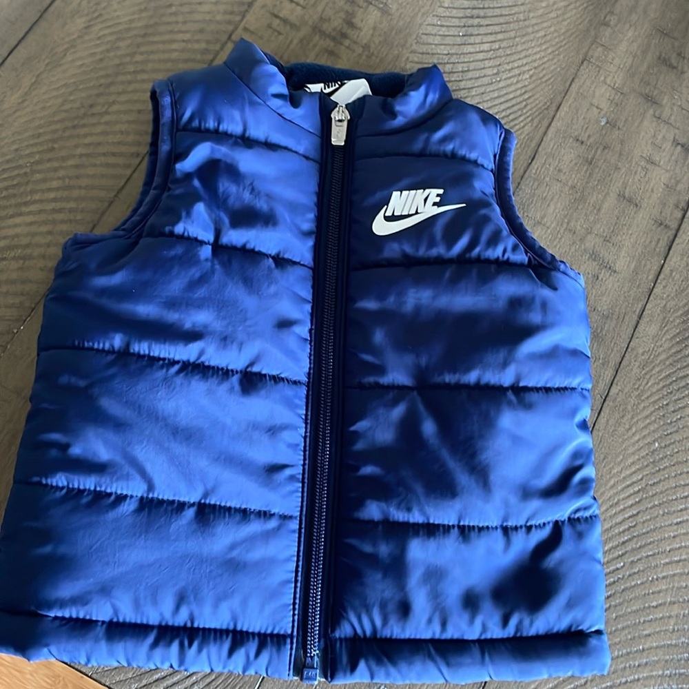 Barley worn baby 12 month navy Nike vest